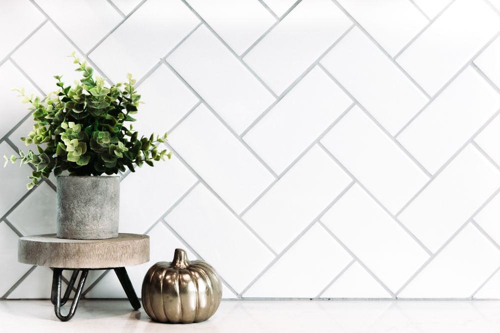 Clean white herringbone tile back splash