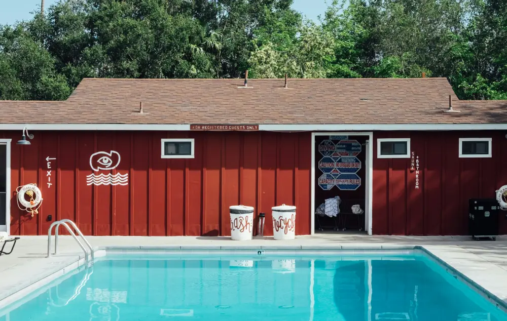 red building by a swimming pool