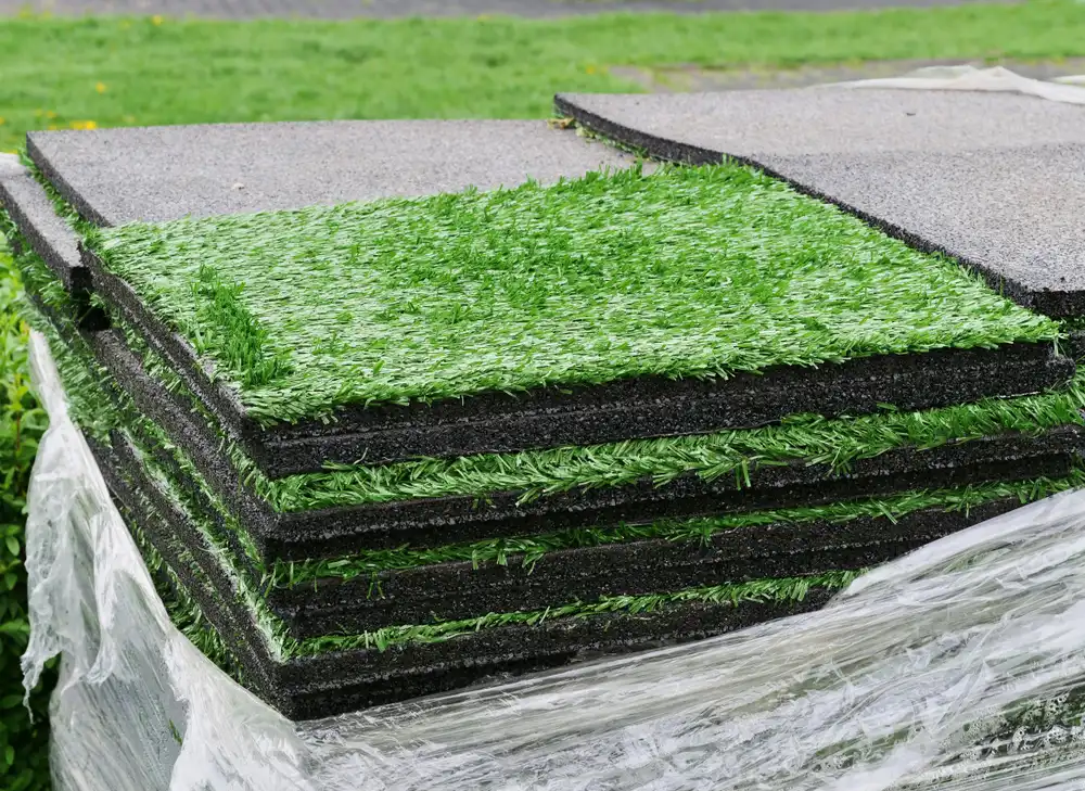 Stack of artificial grass panels