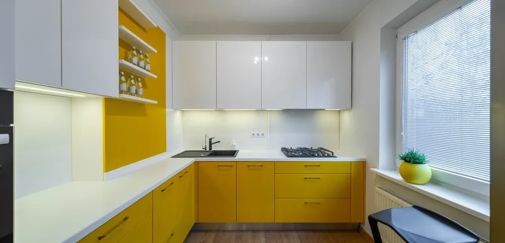 bright kitchen with yellow and white cabinets